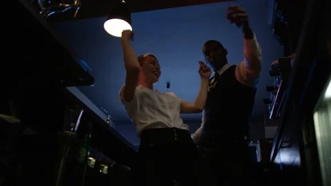 4K Fun Bar Staff Dancing &amp; Enjoying The Atmosphere In Lively Nightclub Stock Footage 75656590