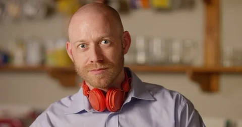 4k, Funny man with wireless headphones listening to music Stock Footage 128407205