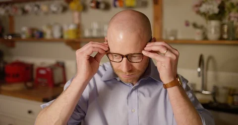 4k, Funny man with wireless headphones listening to music Stock Footage 128407351