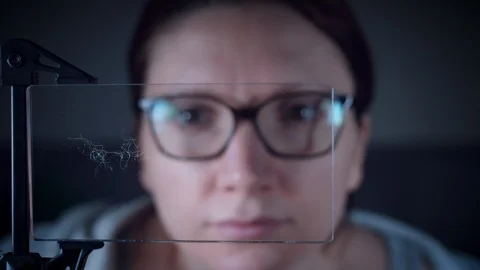 4K Future Transparent Smart Device, Woman Watching Animation Stock Footage 88068847