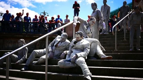 4K At G20 Summit 1000 gray shapes Performance against capitalism justice Stock Footage