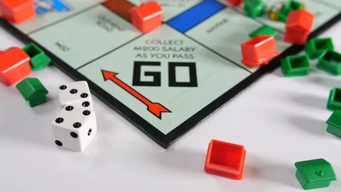 4K game board game, Go sign and plastic house scattered shapes with rolling dice Stock Footage 90790859