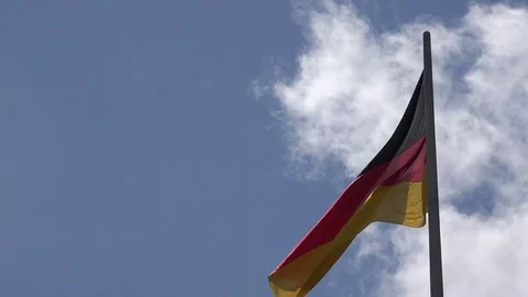 4K Germany flag wave in sunny day national symbol landmark iconic identity proud Stock Footage 72122709