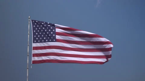 4K: Giant 60' * 40' US Flag Waves in a Stong Wind - Daytime Stock Footage 63088504