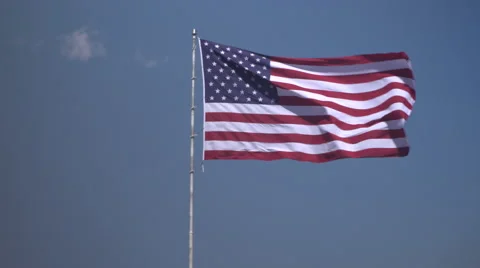 4K: Giant 60' * 40' US Flag Waves in a Stong Wind - Daytime Stock-Footage 63088617