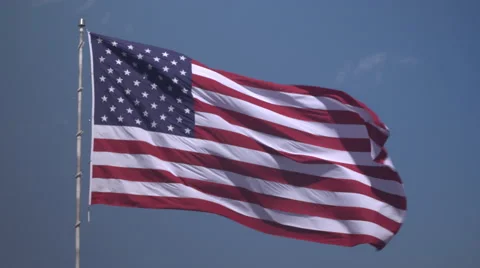 4K: Giant 60' * 40' US Flag Waves in a Stong Wind - Daytime Stock Footage 63088836