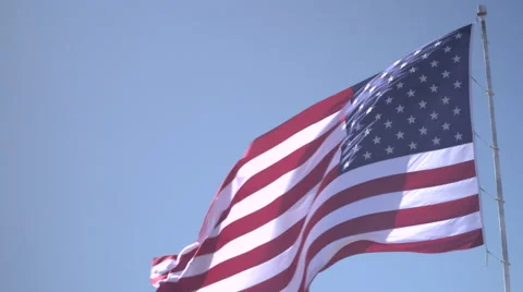 4K: Giant 60' * 40' US Flag Waves in a Stong Wind - Daytime Stock-Footage 63089285
