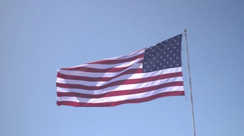 4K: Giant 60' * 40' US Flag Waves in a Stong Wind - Daytime Stock Footage 63089473