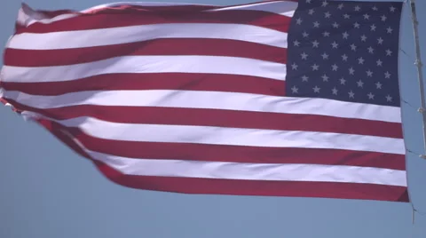 4K: Giant 60' * 40' US Flag Waves in a Stong Wind - Daytime Stock-Footage 63089552
