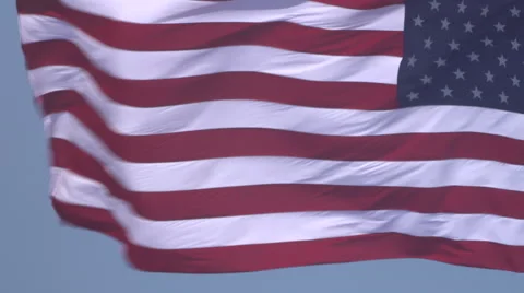 4K: Giant 60' * 40' US Flag Waves in a Stong Wind - Daytime Stock-Footage 63089663