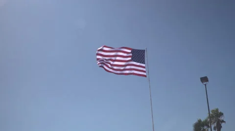 4K: Giant 60' * 40' US Flag Waves in a Stong Wind - Daytime Stock Footage 63089929