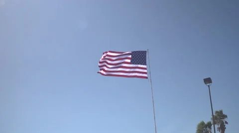 4K: Giant 60' * 40' US Flag Waves in a Stong Wind - Daytime Stock Footage 63090051