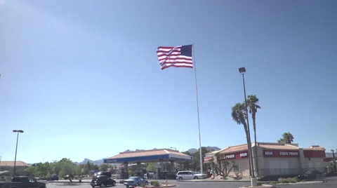 4K: Giant 60' * 40' US Flag Waves in a Stong Wind - Daytime Stock-Footage 63090224