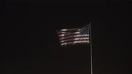 4K - Giant Us Flag Flies At Night Under A Dark Las Vegas Sky Stock Footage