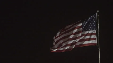 4K: Giant US Flag Waves at Night Against a Black Sky Stock Footage 63085921