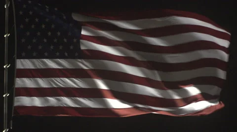 4K: Giant US Flag Waves at Night Against a Black Sky Stock Footage 63086207