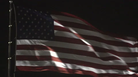 4K: Giant US Flag Waves at Night Against a Black Sky Stock Footage 63086251