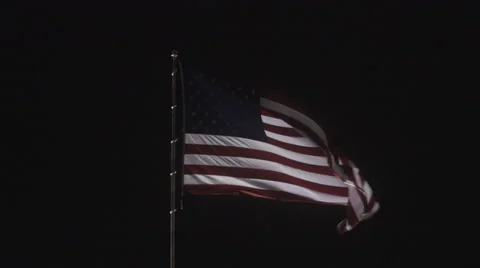 4K: Giant US Flag Waves at Night Against a Black Sky Stock Footage 63086374