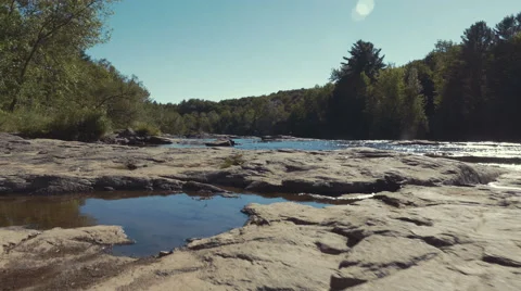 4k - Gimbal low shot of a small river Stock Footage 67557352