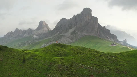 4K Giu Pass  drone flight video around trekker on green hill beautiful morning Stock-Footage 157884485