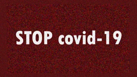 4K. Glitch screen saver with text STOP Covid-19 for news and advertisement on tv Stock Footage 128732847
