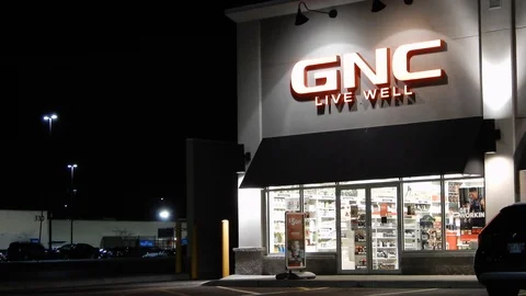 4K GNC Store Front With Logo At Night | Stock Video | Pond5