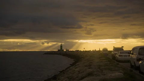 4k Golden Hour, Sun rays over Lighthouse South Mole Fremantle Video stock 239183340