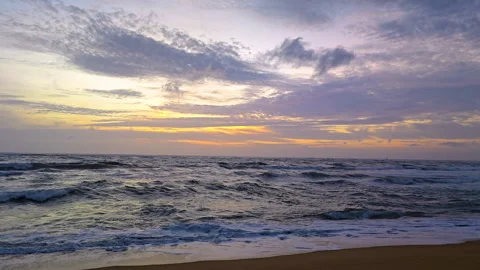 4K Golden Hour Sunset at Empty Beach with Purple Blue Sky and Waves Stock Footage 314522103