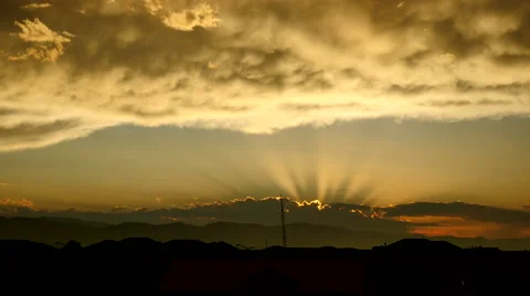 4K Golden Sunbeam Rays over the Rockies Stock Footage 54716022