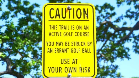 4K Golf Course Caution Sign, Yellow Warning Message Stock Footage 76275384