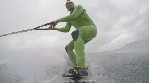4K GoPro view of Pro surfer Garrett McNamara water skiing in wild ocean Stock Footage 157702694