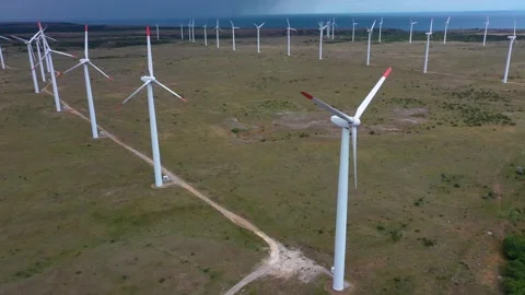 4K Gradual shutdown of a wind turbine farm. Aerial view of a wind turbine Stock Footage 265221017