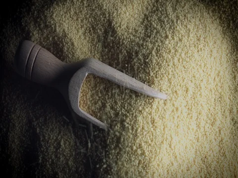 4k Grains Background, Couscous Pouring on the Scoop Stock Footage 77645797