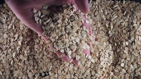 4K Grains Background, Hand Taking Whole Oats 스톡 동영상 77827254