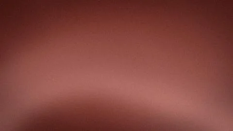 4K grainy textured background with brown reddish and pink gradient blur abs.. 스톡 사진