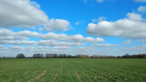 4k green field and cloudy sky. timelapse. Stock Footage 97920665