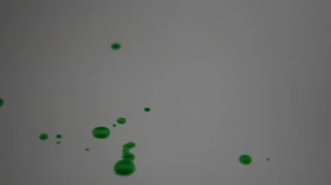 4K Green paint splashed onto white paper Stock Footage 63135161