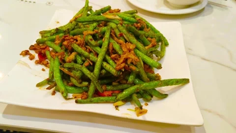 4K green vegetarian fried string beans on white marble table at Asian Chine.. 動画素材 318180238