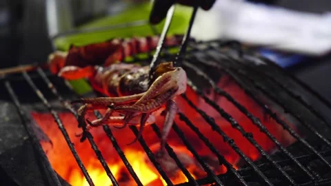 4K Grilled Squid on Open Flame Street Food Stock Footage 312542555