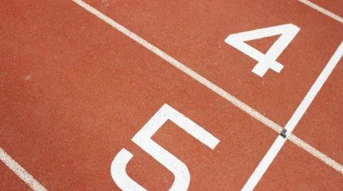 4K Group of athletes (disabled &amp; able bodied) celebrate victory on running track Stock Footage 56482047