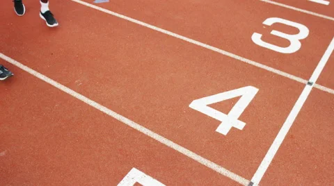 4K Group of athletes (disabled &amp; able bodied) celebrate victory on running track Stock Footage 56482116
