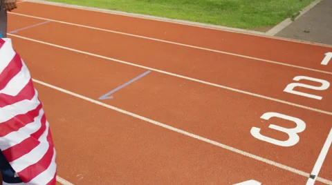 4K Group of athletes (disabled &amp; able bodied) celebrate victory on running track Stock Footage 56484193