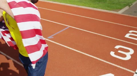 4K Group of athletes (disabled &amp; able bodied) celebrate victory on running track Stock Footage 56484417