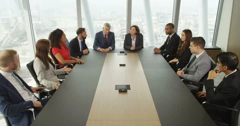 4k, Group of business persons having a meeting around a large table in an office Stock Footage 68964061