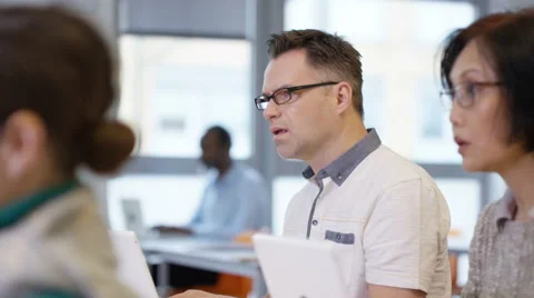 4K Group of mature students in adult education class, working on laptop computer Stock Footage