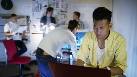 4K Group of young male computer programmers working together in small office Stock Footage 54445859