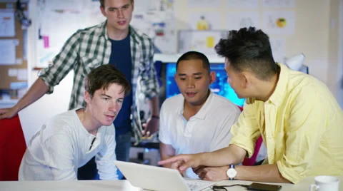 4K Group of young male computer programmers working together in small office Stock Footage 54482709