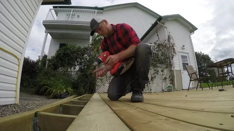4k guy building deck Stock Footage 51740686