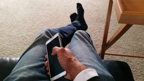 4K Guy Scrolling On Cellphone At Home Stock Footage 71568184