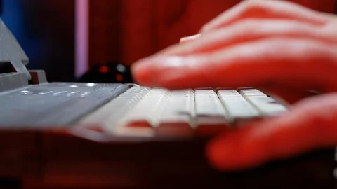 4k Hacker works at dark room spy soft developing with red background light hands Stock Footage 86731167